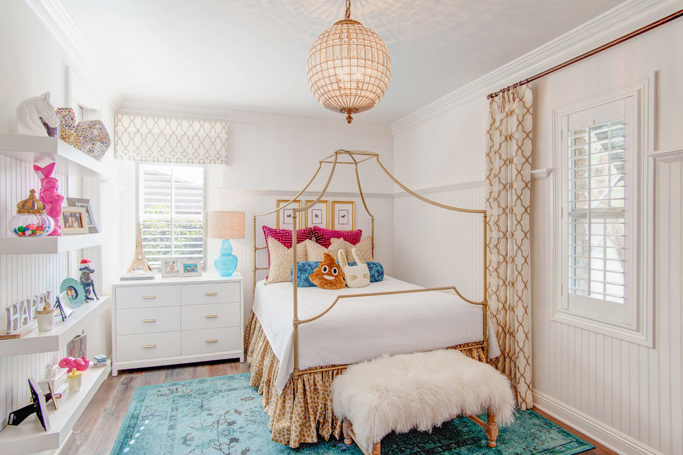 Photo of a transitional kids' room for girls in Las Vegas with white walls, dark hardwood floors and brown floor.