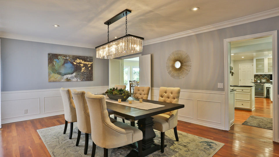 Inspiration for a mid-sized transitional light wood floor and brown floor enclosed dining room remodel in Phoenix with gray walls