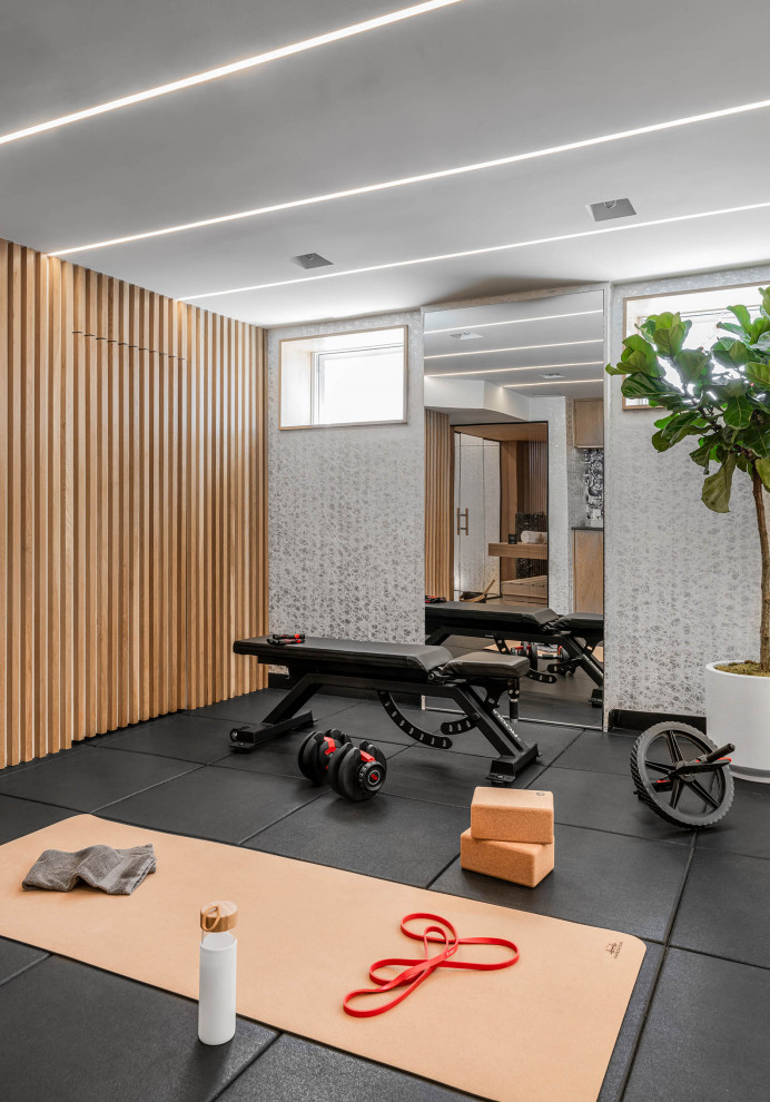 Inspiration for a small contemporary black floor home weight room remodel in Boston with white walls