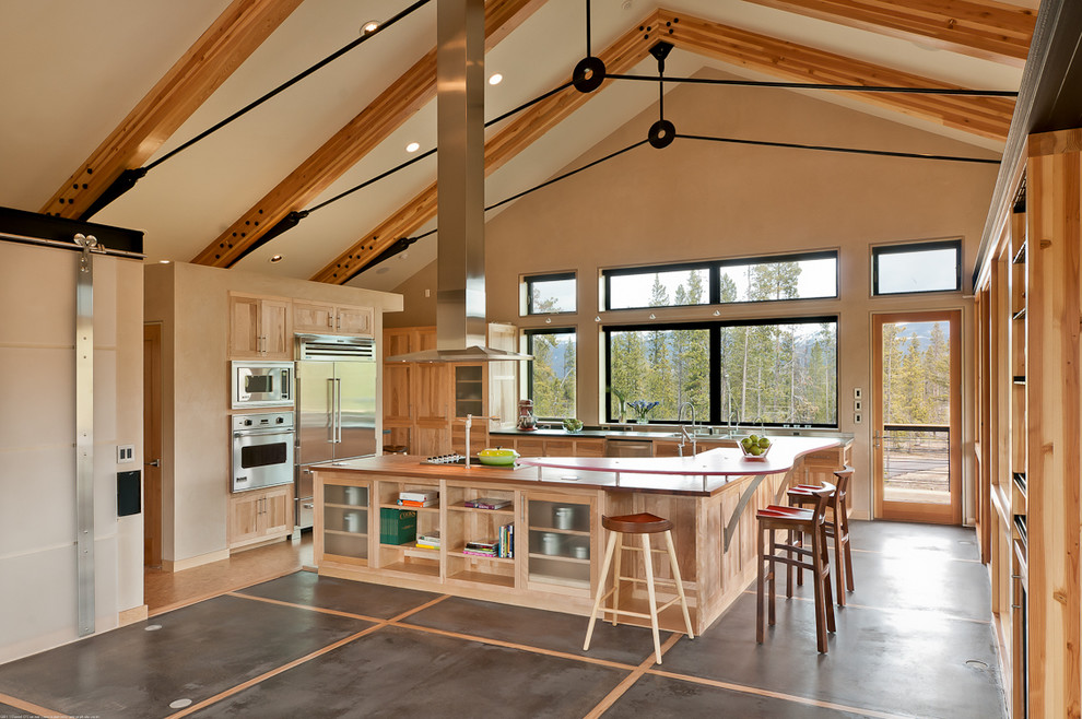 Design ideas for a country u-shaped open plan kitchen in Denver with a triple-bowl sink, beaded inset cabinets, light wood cabinets, wood benchtops, stainless steel appliances and with island.