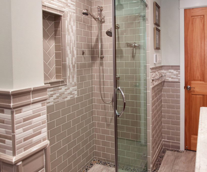 Inspiration for a large transitional master beige tile alcove shower remodel