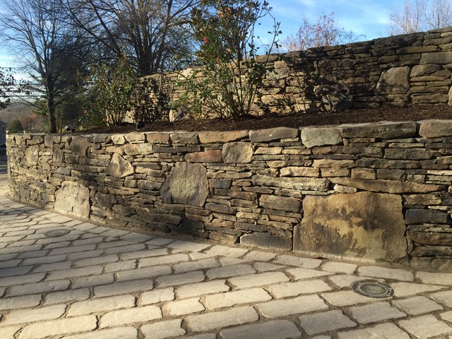 Rustic Fieldstone Two Tier Retaining Wall Alongside Of Cobblestone This Is An Example Of A Large Clic Sloped Driveway Partial Sun Garden For Winter In