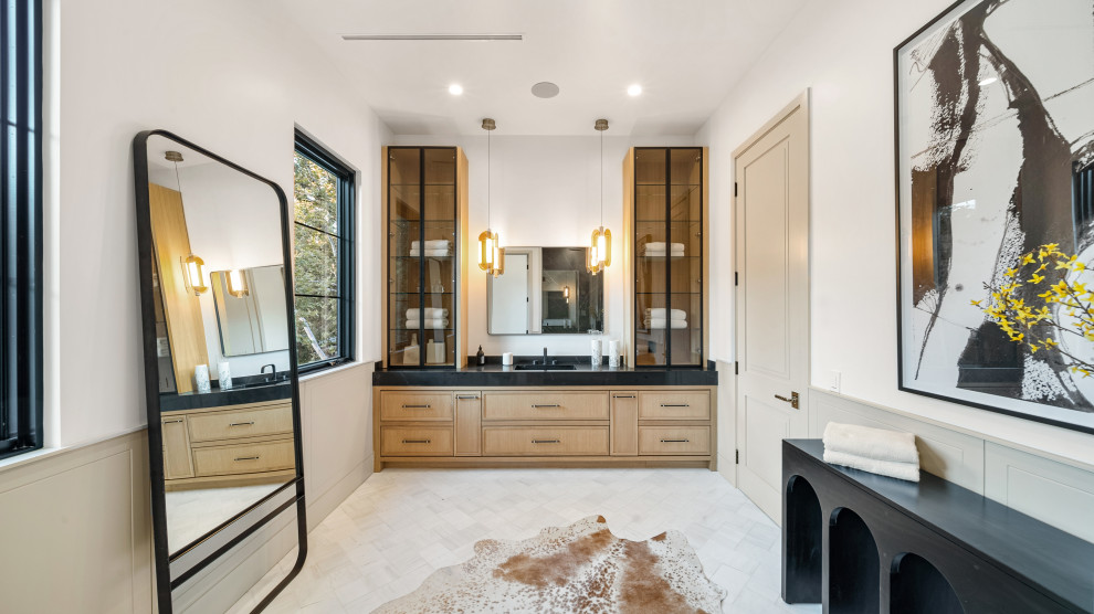 Inspiration for a transitional 3/4 bathroom in Los Angeles with shaker cabinets, black cabinets, ceramic floors, marble benchtops, multi-coloured floor, a hinged shower door, black benchtops, a niche, a single vanity, a built-in vanity and wallpaper.