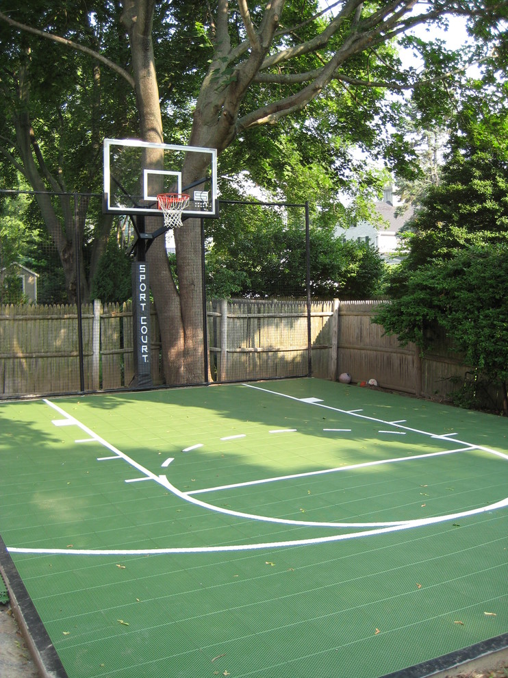 Photo of a small traditional backyard partial sun outdoor sport court in Boston with with outdoor playset and concrete pavers.