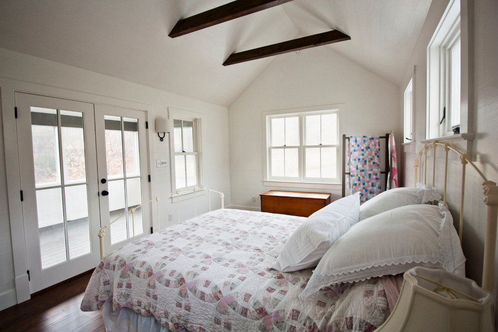 Inspiration for a mid-sized country master bedroom in Other with white walls, dark hardwood floors and no fireplace.