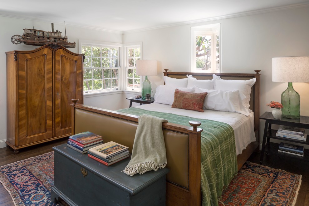 Design ideas for a mid-sized traditional master bedroom in Orange County with dark hardwood floors.