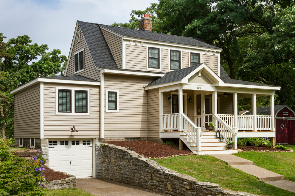 Inspiration for a timeless beige wood house exterior remodel in Minneapolis with a shingle roof