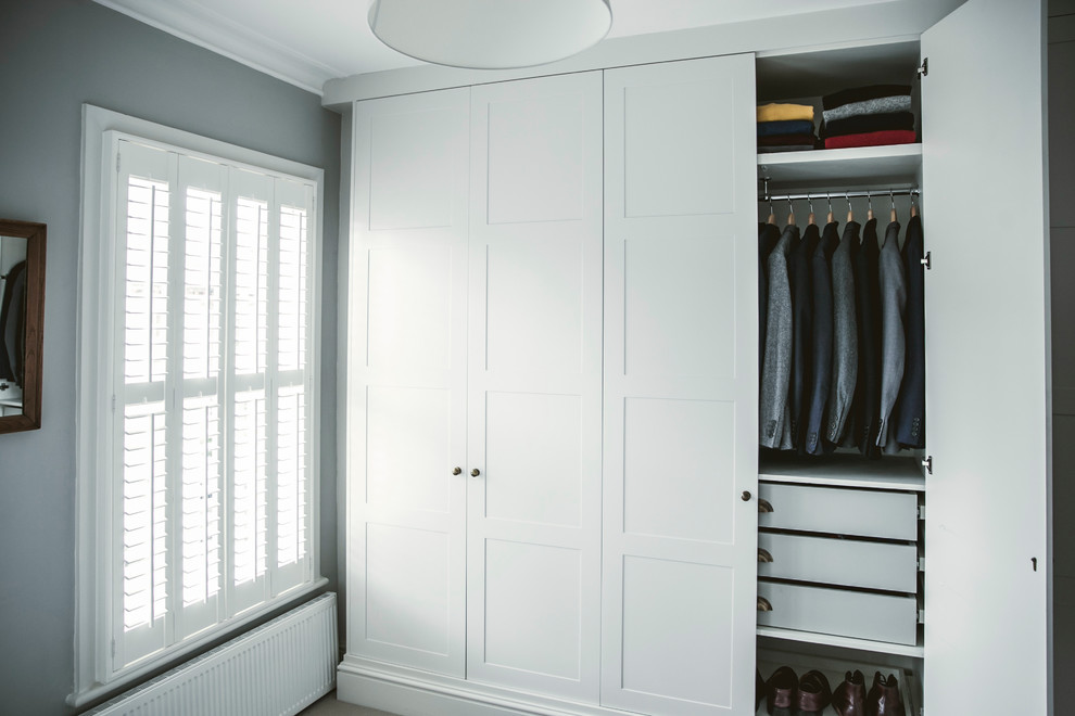 Photo of a contemporary storage and wardrobe in London.