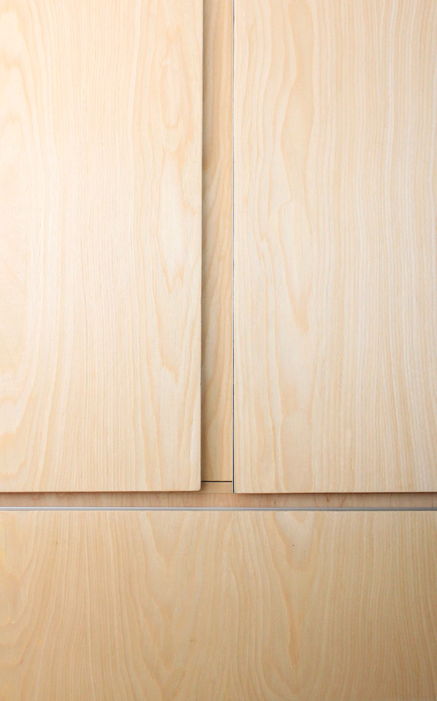 Eat-in kitchen - mid-sized modern u-shaped porcelain tile eat-in kitchen idea with a double-bowl sink, flat-panel cabinets, light wood cabinets, granite countertops and stainless steel appliances