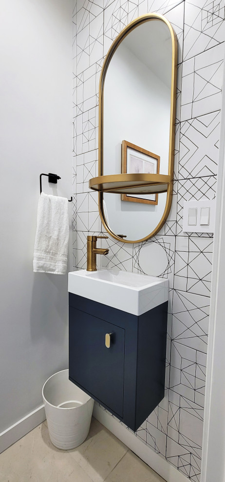 Photo of a small modern cloakroom in Los Angeles with flat-panel cabinets, blue cabinets, a one-piece toilet, white tiles, porcelain tiles, white walls, porcelain flooring, an integrated sink, solid surface worktops, beige floors, white worktops and a floating vanity unit.