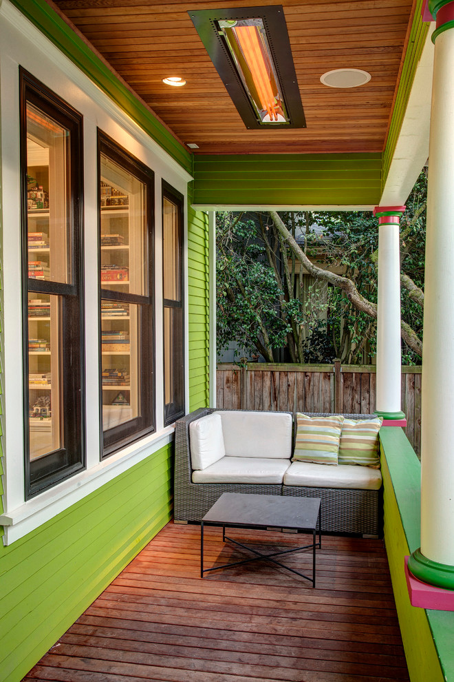 Photo of an arts and crafts verandah in Seattle with decking and a roof extension.