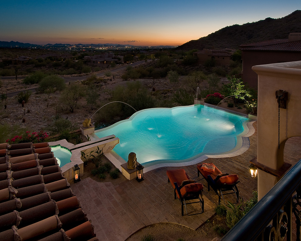 Mediterranean pool in Phoenix with brick pavers.