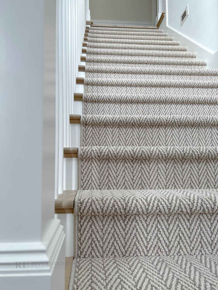 Inspiration for a large classic carpeted straight wood railing staircase in Other with carpeted risers and panelled walls.