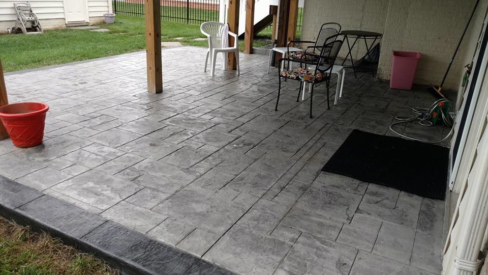 Design ideas for a mid-sized traditional backyard patio in Other with a fire feature, stamped concrete and no cover.