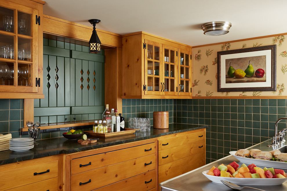 Design ideas for a country galley separate kitchen in Minneapolis with glass-front cabinets, medium wood cabinets, green splashback, ceramic splashback and with island.