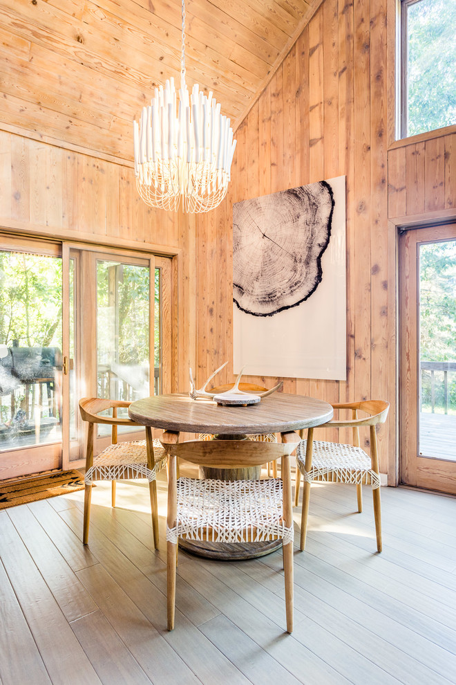 Example of a mountain style light wood floor and beige floor dining room design in Chicago with brown walls