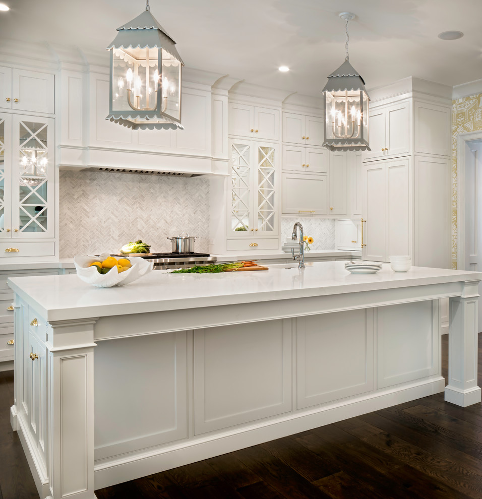 Inspiration for a large traditional u-shaped eat-in kitchen in Jacksonville with a farmhouse sink, beaded inset cabinets, white cabinets, stainless steel appliances, dark hardwood floors, with island and white benchtop.