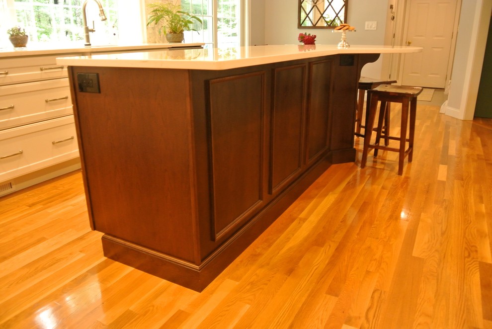 Transitional medium tone wood floor eat-in kitchen photo in Boston with an undermount sink, shaker cabinets, quartz countertops, beige backsplash, mosaic tile backsplash, stainless steel appliances, an island and white countertops