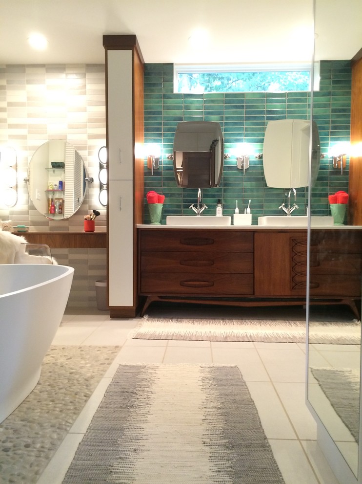 Photo of a large midcentury master bathroom in Richmond with furniture-like cabinets, medium wood cabinets, a freestanding tub, a corner shower, a one-piece toilet, blue tile, terra-cotta tile, white walls, ceramic floors, a vessel sink and marble benchtops.