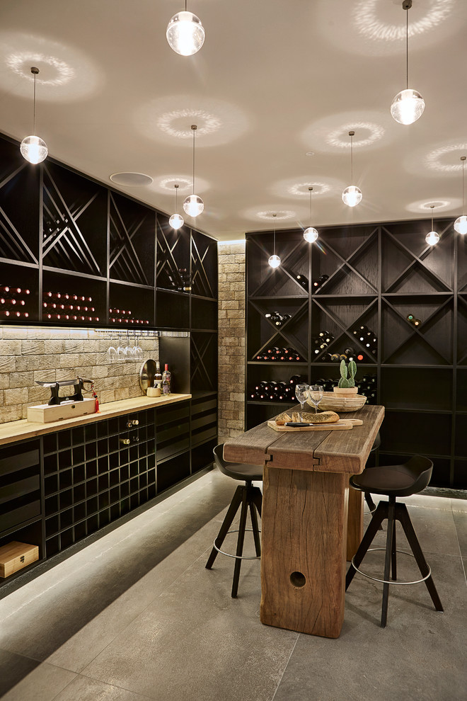 Design ideas for a scandinavian wine cellar in Aalborg with concrete floors and diamond bins.