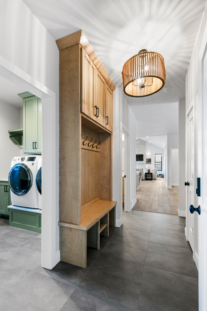 Inspiration for a large transitional vinyl floor and gray floor foyer remodel with white walls