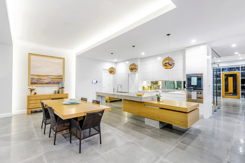 This is an example of a mid-sized modern kitchen in Sydney.