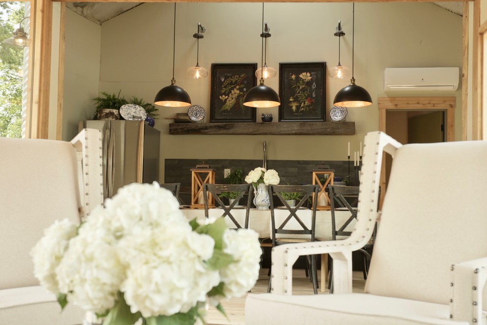 Open concept kitchen - small transitional single-wall light wood floor open concept kitchen idea with an undermount sink, flat-panel cabinets, black cabinets, granite countertops, multicolored backsplash, stainless steel appliances, no island and gray countertops