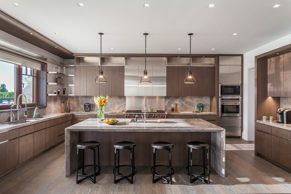 Design ideas for a mid-sized contemporary u-shaped kitchen in New York with flat-panel cabinets, marble benchtops, stainless steel appliances, dark hardwood floors, with island, an undermount sink, dark wood cabinets and metallic splashback.