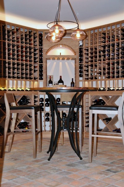 Inspiration for a large traditional wine cellar in New York with storage racks.