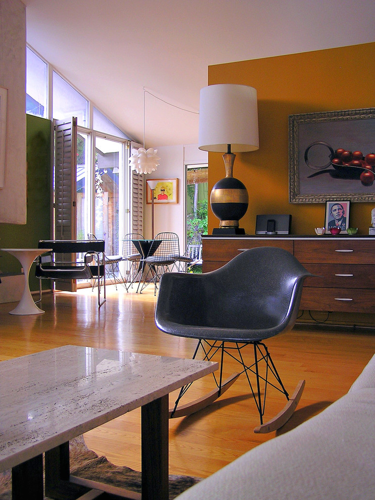 Inspiration for a midcentury living room in Orange County with orange walls and orange floor.