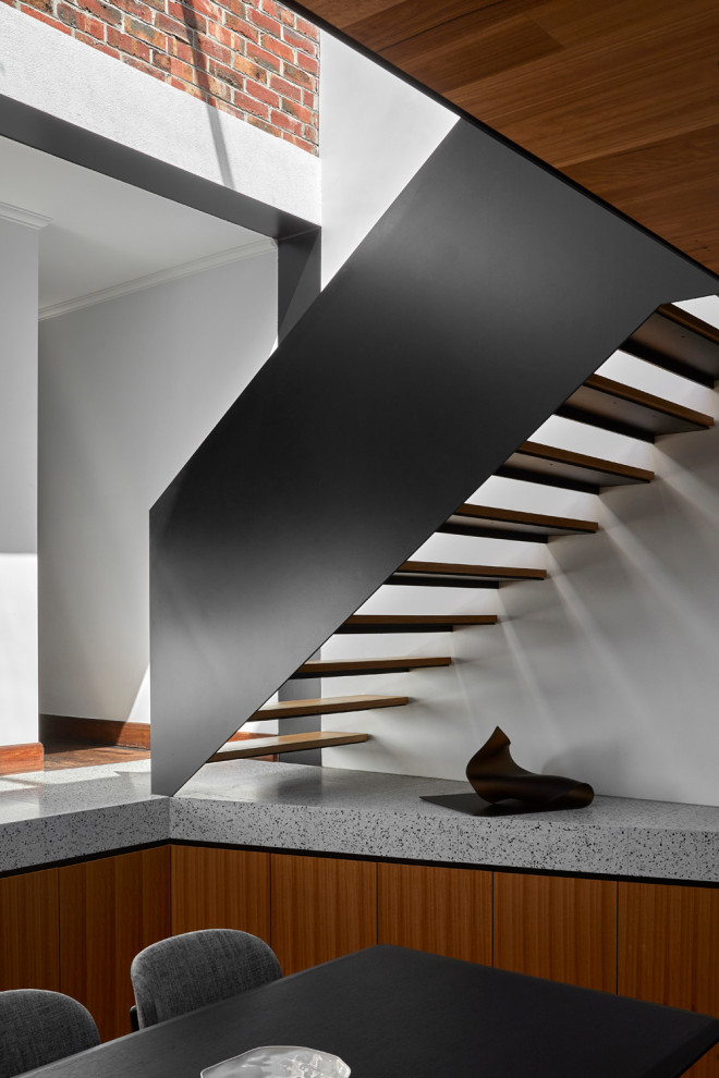 Staircase - mid-sized contemporary wooden straight open and metal railing staircase idea in Melbourne