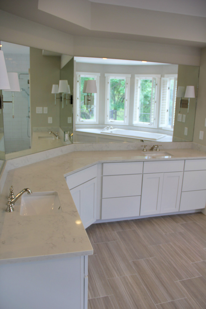 Inspiration for a large traditional master bathroom in Austin with shaker cabinets, white cabinets, grey walls, porcelain floors, an undermount sink, engineered quartz benchtops, beige floor and white benchtops.
