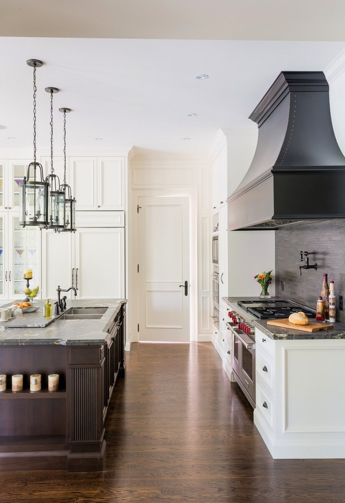 Design ideas for a traditional l-shaped kitchen in Toronto with a double-bowl sink, white cabinets, panelled appliances and dark hardwood floors.
