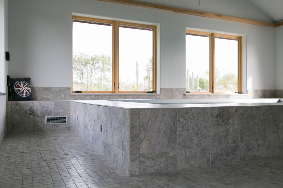 Inspiration for a mid-sized transitional indoor tile and rectangular lap pool house remodel