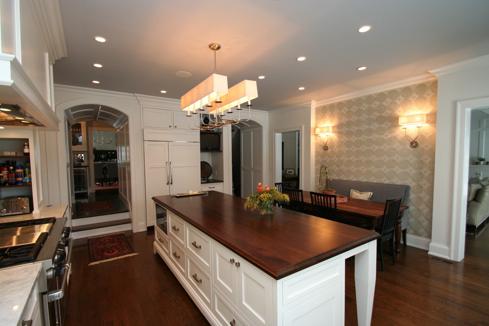 Inspiration for a large transitional l-shaped dark wood floor open concept kitchen remodel in Chicago with flat-panel cabinets, white cabinets, granite countertops, blue backsplash, ceramic backsplash, stainless steel appliances and an island