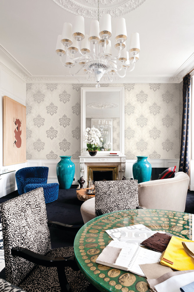 Mid-sized eclectic formal enclosed living room in New York with white walls, carpet, a standard fireplace, a metal fireplace surround and no tv.