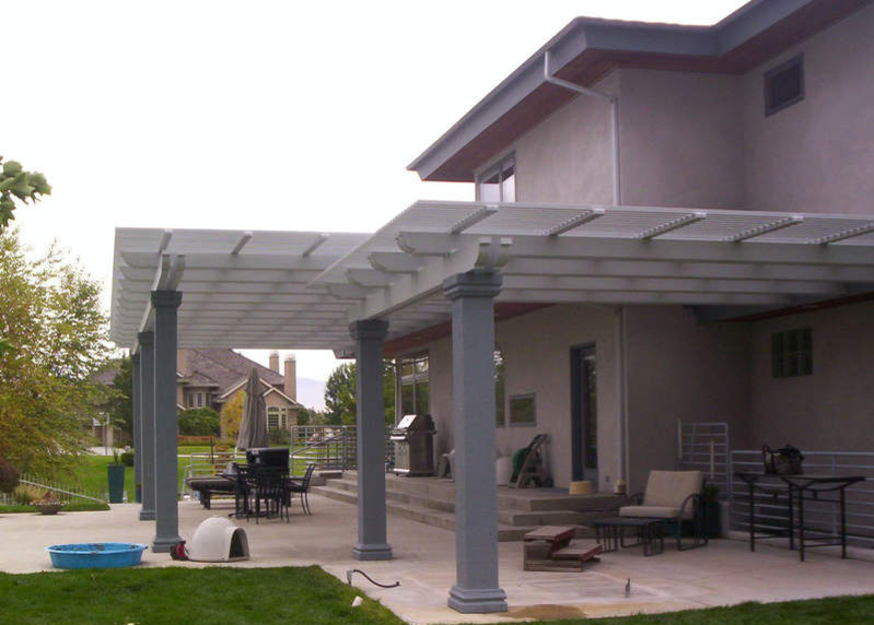 Inspiration for a small transitional side yard deck remodel in Boise with a roof extension