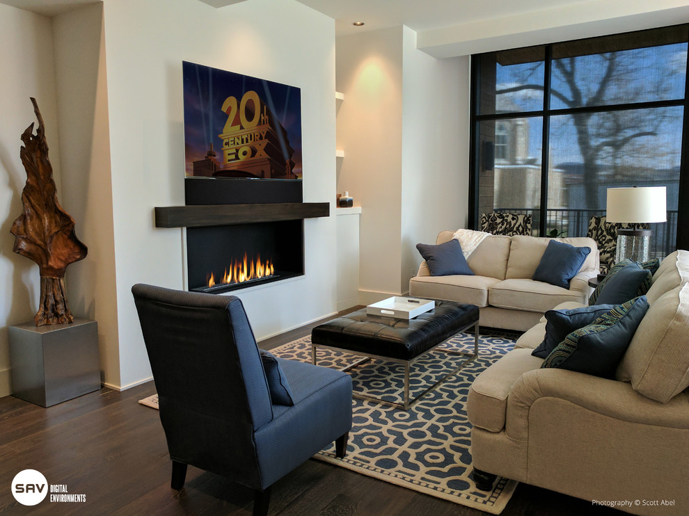 Inspiration for a mid-sized contemporary enclosed family room in Other with dark hardwood floors, a ribbon fireplace, a plaster fireplace surround and a wall-mounted tv.