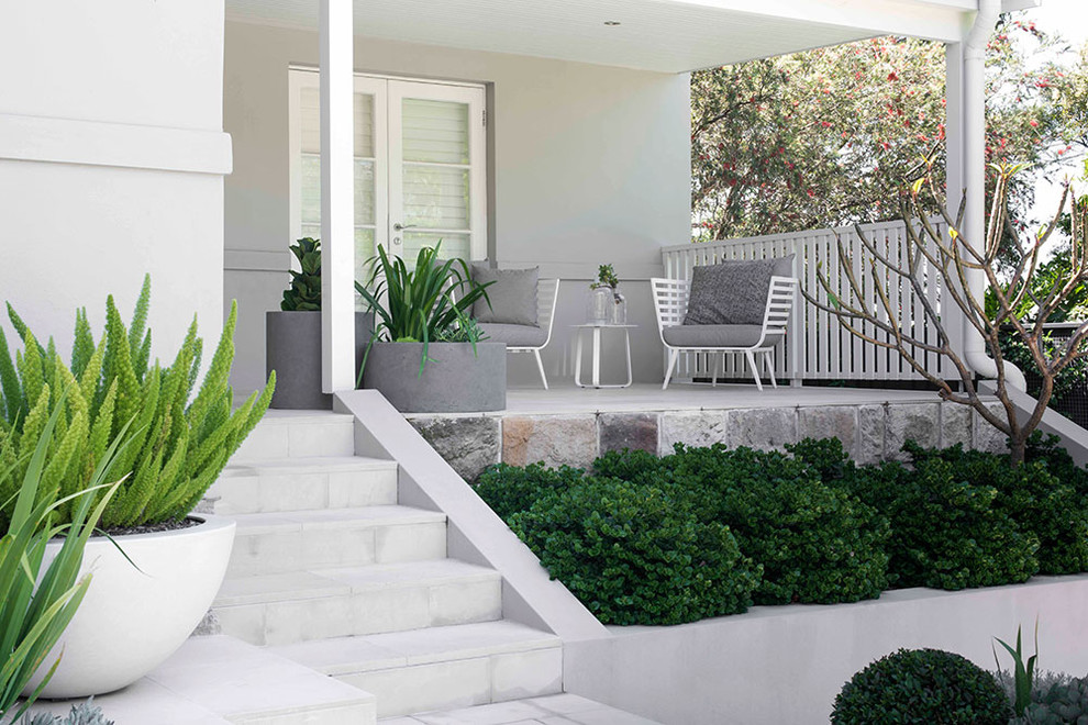 Small contemporary backyard full sun garden in Sydney with a water feature and concrete pavers.