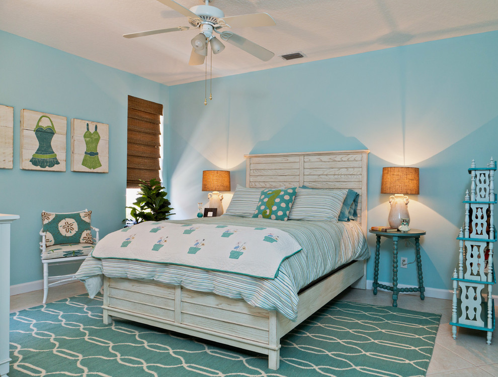 Design ideas for a beach style bedroom in Miami with blue walls.