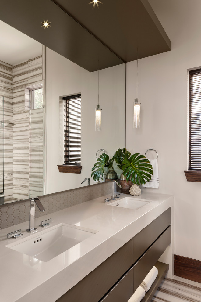 This is an example of a mid-sized modern master bathroom in Miami with flat-panel cabinets, brown cabinets, an alcove shower, beige walls, an undermount sink, a hinged shower door and beige benchtops.