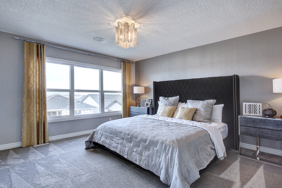 Design ideas for a large modern master bedroom in Calgary with grey walls and carpet.