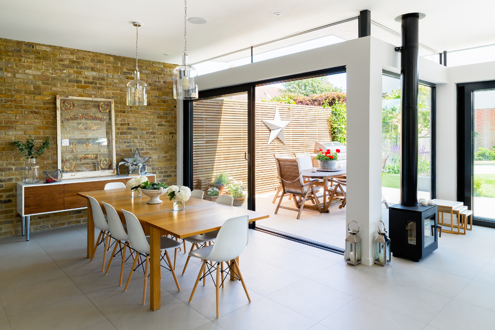 Inspiration for a large contemporary great room remodel in London with white walls