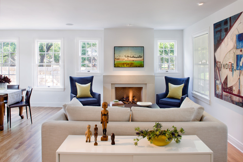 Transitional living room in Austin with white walls and a standard fireplace.