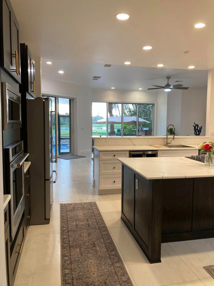 Example of a large minimalist l-shaped porcelain tile and white floor eat-in kitchen design in Dallas with an island, shaker cabinets, gray cabinets, marble countertops, white countertops, a single-bowl sink and stainless steel appliances