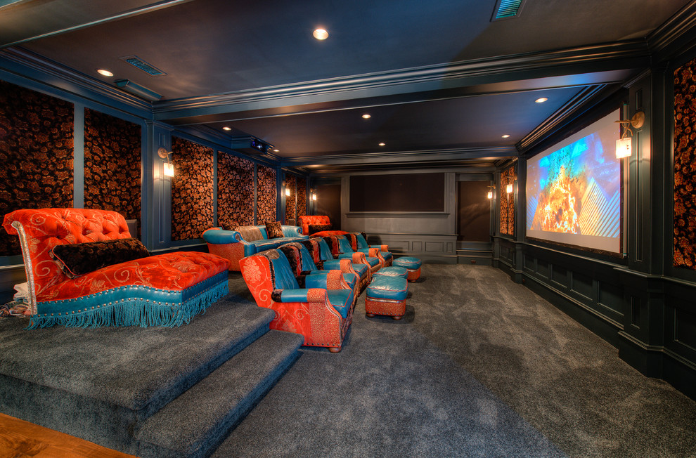 Eclectic enclosed home theatre in Charleston with multi-coloured walls, carpet, grey floor and a projector screen.