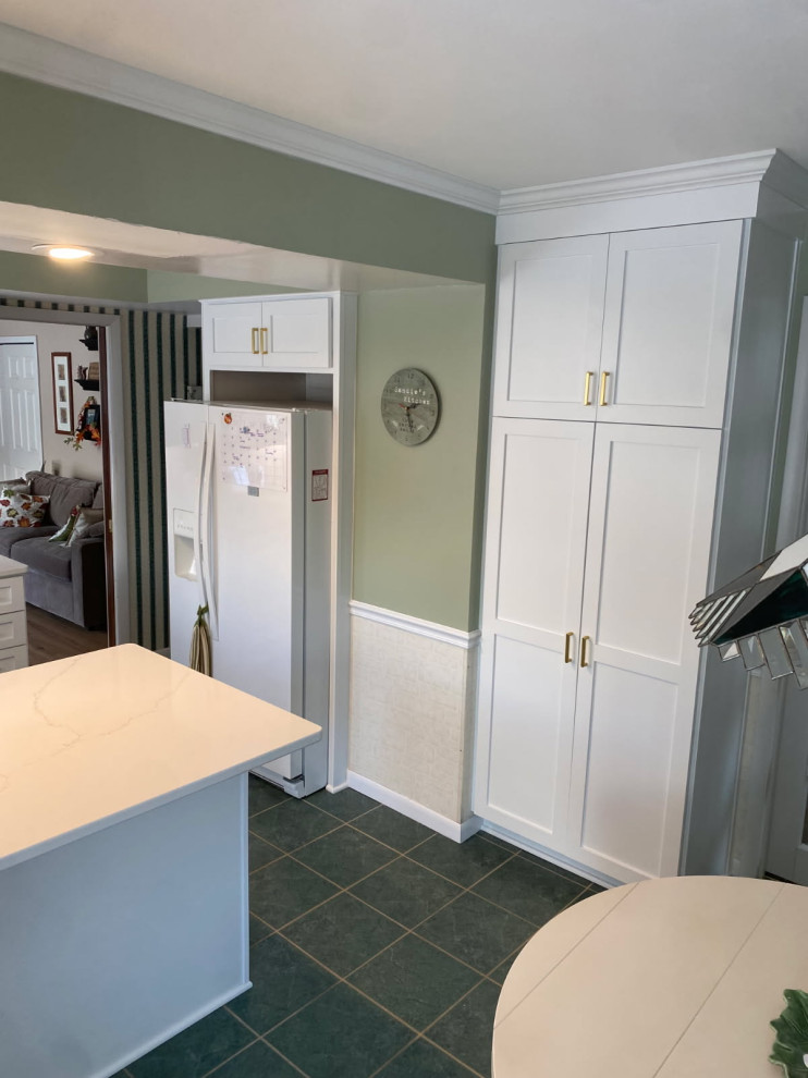 Mid-sized transitional u-shaped enclosed kitchen photo with shaker cabinets, white cabinets and quartz countertops