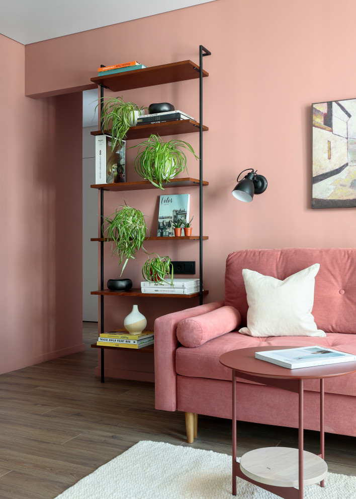 Medium sized scandinavian living room in Saint Petersburg with pink walls, medium hardwood flooring and brown floors.
