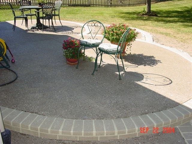 Inspiration for a large traditional backyard patio in St Louis with concrete pavers and no cover.