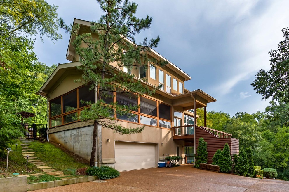 Example of a transitional home design design in Nashville